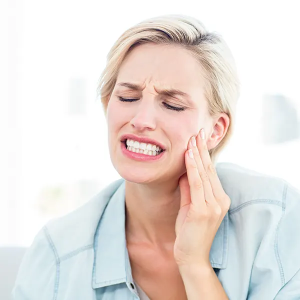 Woman Feeling Tooth Pain | Emergency Dentist